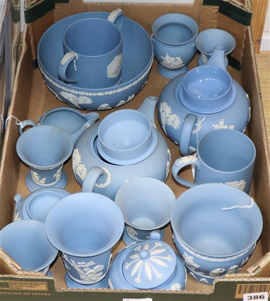 A collection of Wedgwood pale blue ground Jasperware, including two teapots,